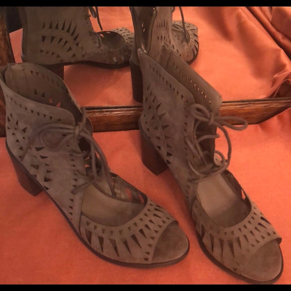 New Breckelle’s tan suede peep toe lace up sandal.